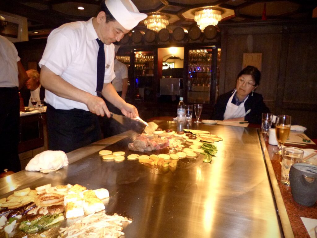 Teppanyaki chef preparing food